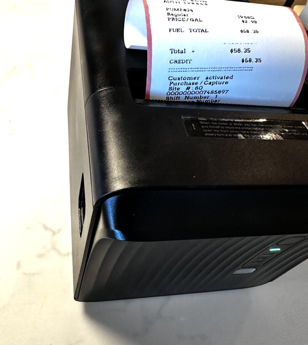 Receipt being printed using thermal printer from image generated at ExpenseFAST.com